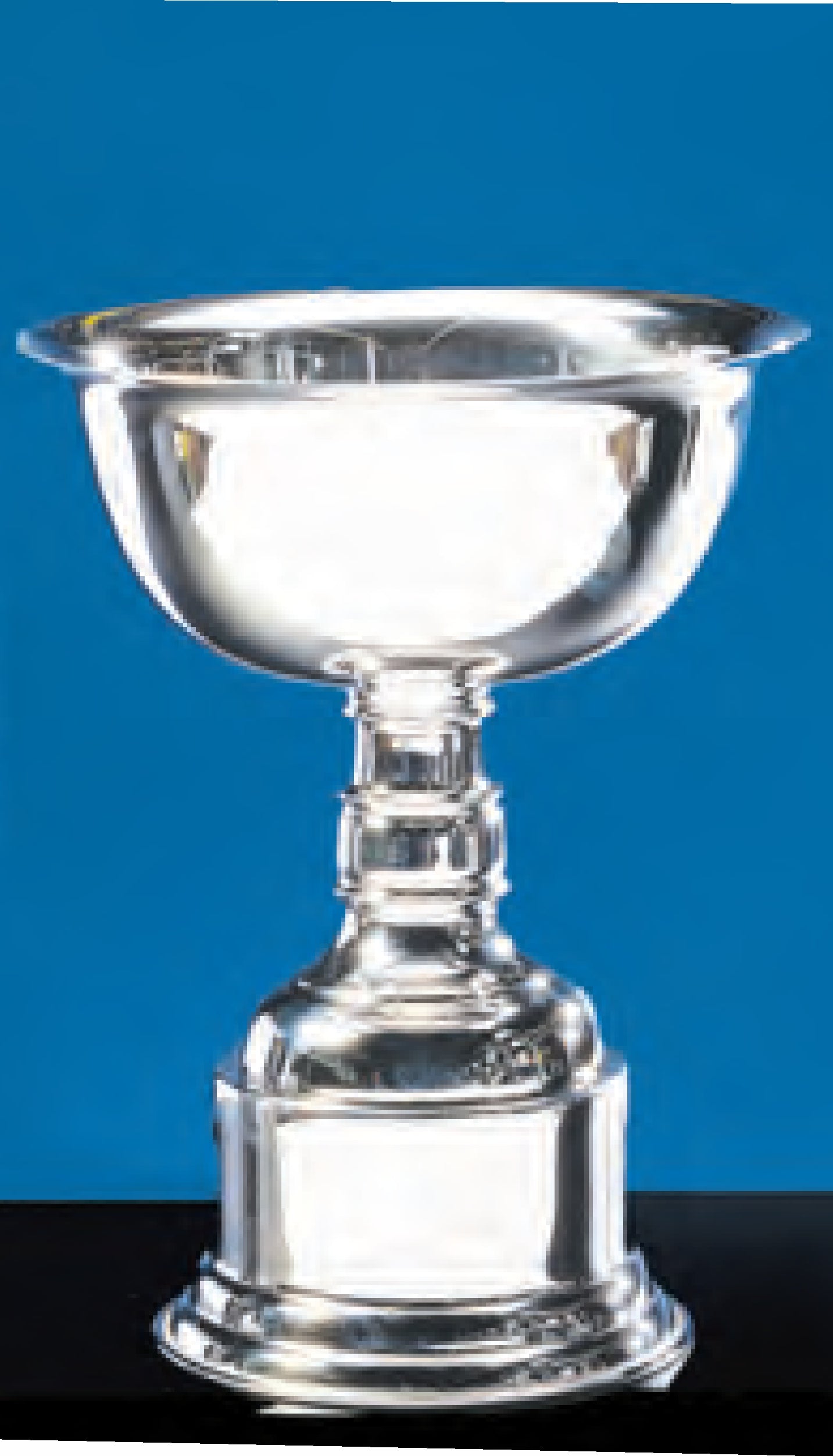 The Prize Possessions Silverplate Cup, featuring a wide bowl and sturdy base, is displayed against a blue background—an ideal trophy for corporate recognition.