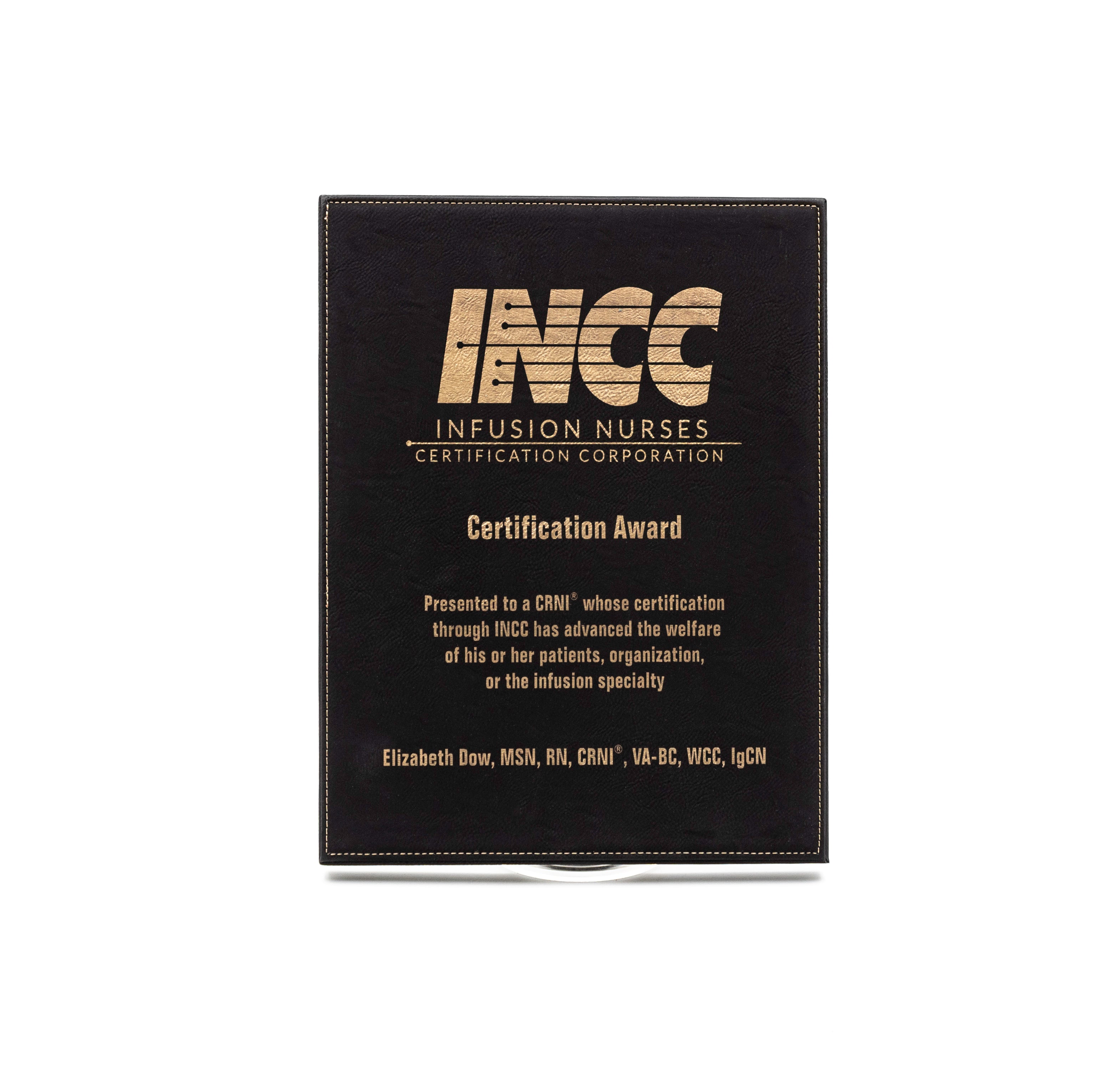 The Prize Possessions Black/Gold Leatherette Plaque, featuring the INCC logo, recognizes Elizabeth Dow’s contributions to patient care and infusion specialty advancement through her certification.