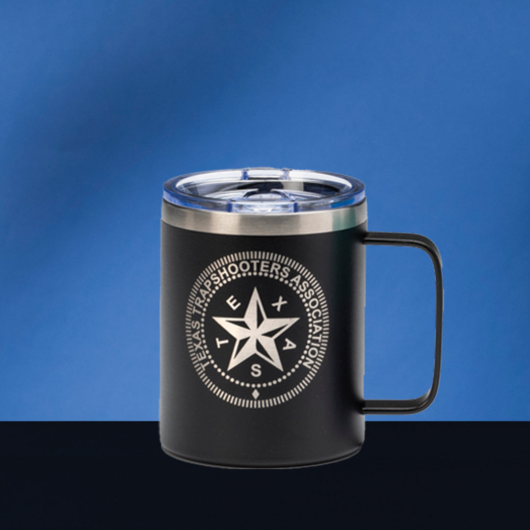 The Prize Possessions Black Travel Mug with Handle features a clear lid and the Texas Shooters Association logo in white—an ideal commuter drinkware choice for staying refreshed on the go.
