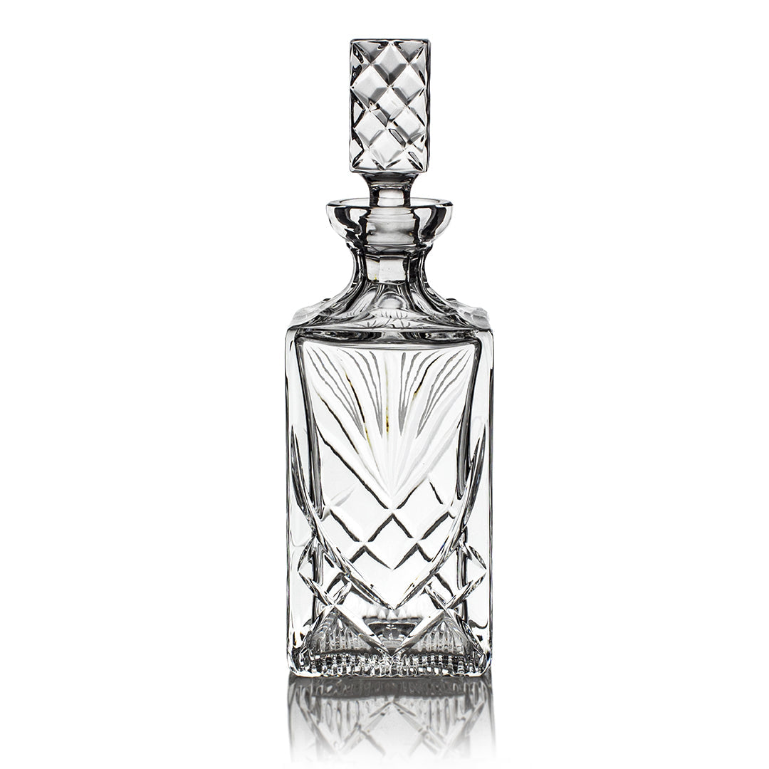 The Prize Possessions Crystal Decanter features intricate diamond-cut patterns and a square stopper, standing upright against a white background—perfect for whiskey.