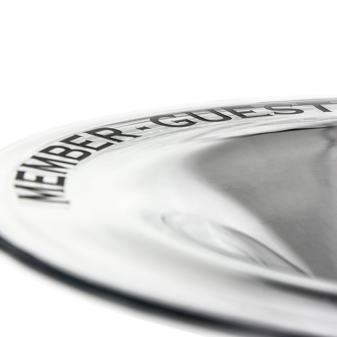 Close-up of the Crystal Fusion Bowl by Prize Possessions, featuring "MEMBER • GUEST" etched on the rim—photographed at an angle against a white background—ideal as a modern home decor centerpiece.