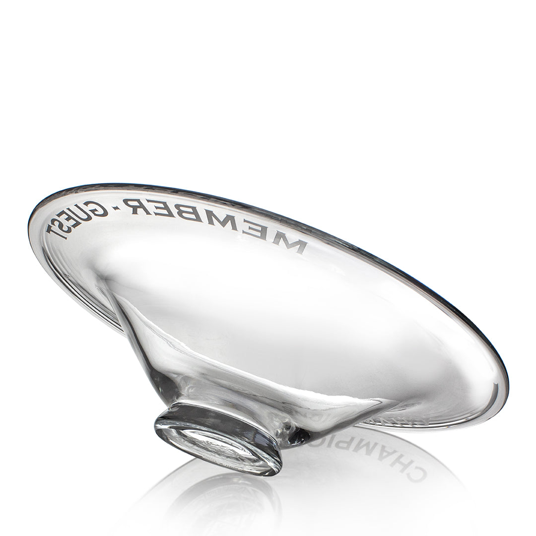 The Crystal Fusion Bowl by Prize Possessions features MEMBER, GUEST, and CHAMPION etched around its clear rim. Its transparent design makes it a striking modern centerpiece for any home décor.