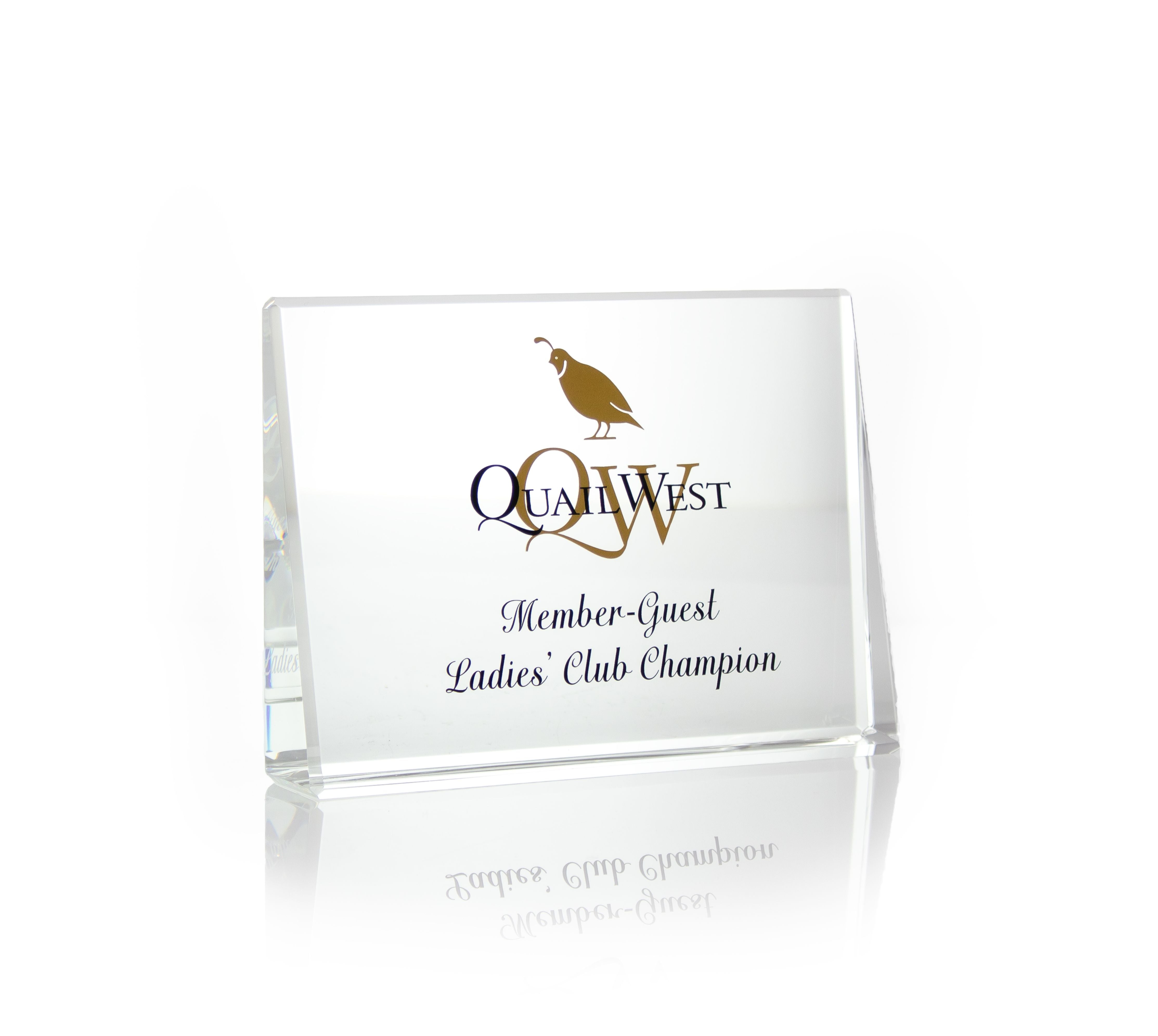 The Crystal Horizontal Award by Prize Possessions features gold and black text with a bird logo, engraved with Quail West, Member-Guest, Ladies Club Champion. Ideal for recognition, this clear glass piece stands out on any display.