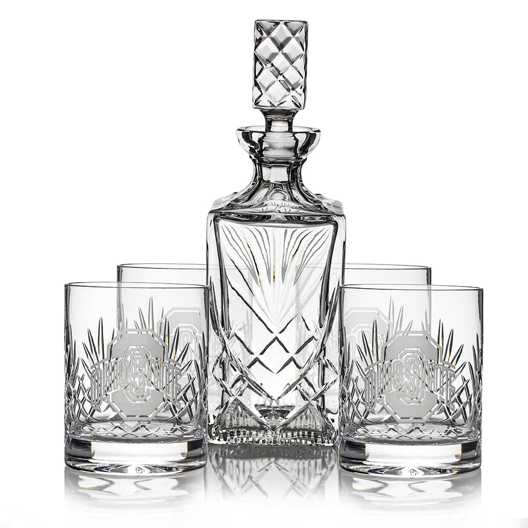 The Prize Possessions DOF Glass/Decanter Gift Set (4 ea. 1429/1 ea. 1542) features a stylish decanter with a square stopper and four matching glasses—an elegant choice for any home bar glassware collection.
