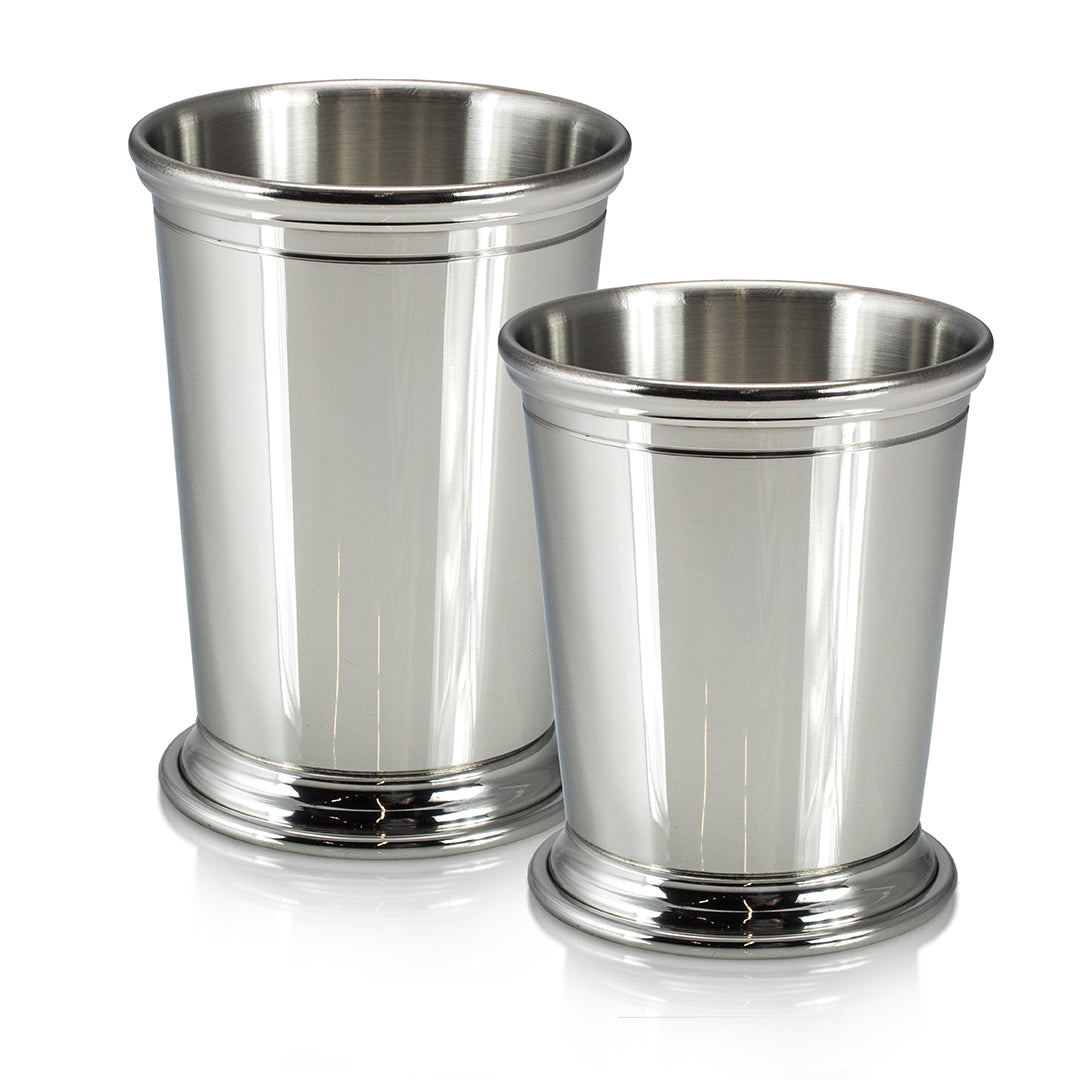 Two Fine Pewter Essex Cups by Prize Possessions, featuring shiny silver finishes and rounded bases, are placed side by side on a white background. The cup on the left is slightly taller than the one on the right.