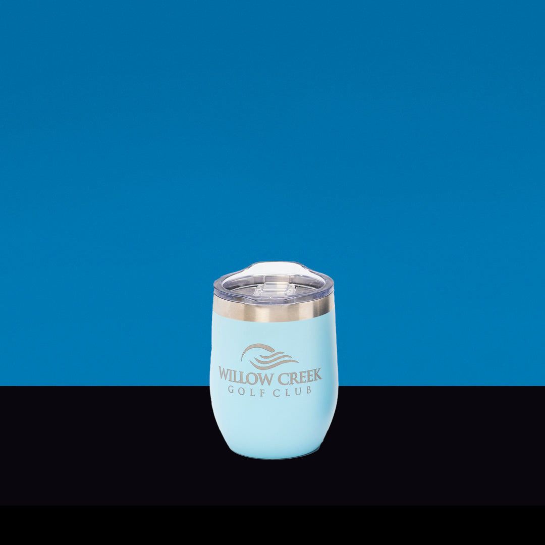 The Prize Possessions Light Blue Wine Tumbler features a clear lid, silver rim, and Willow Creek Golf Club logo—perfect outdoor drinkware for golf enthusiasts, set against a striking blue and black background.