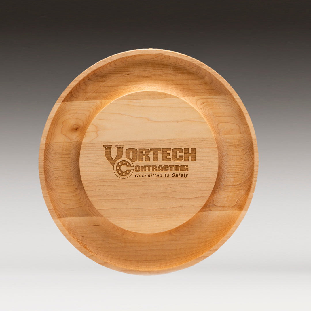 The Maple Round Cheese Board by Prize Possessions features an engraved VORTECH CONTRACTING Committed to Safety logo at its center, displayed on a gradient gray background.