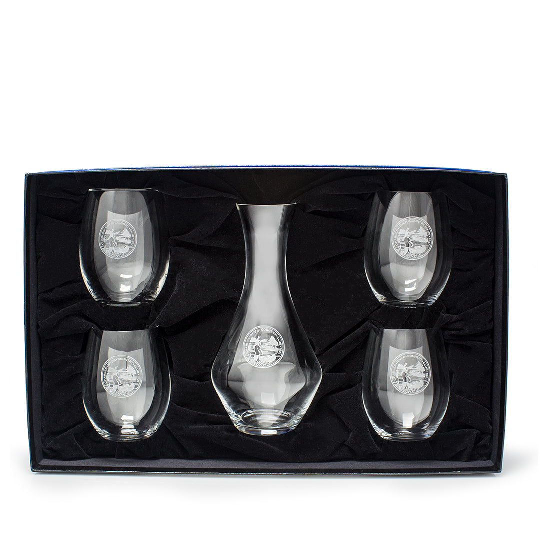 The Prize Possessions Riedel Stemless Wine Glasses/Decanter Gift Set includes a clear glass decanter and four matching stemless glasses, all with a circular etched design, beautifully boxed—ideal for wine tasting.