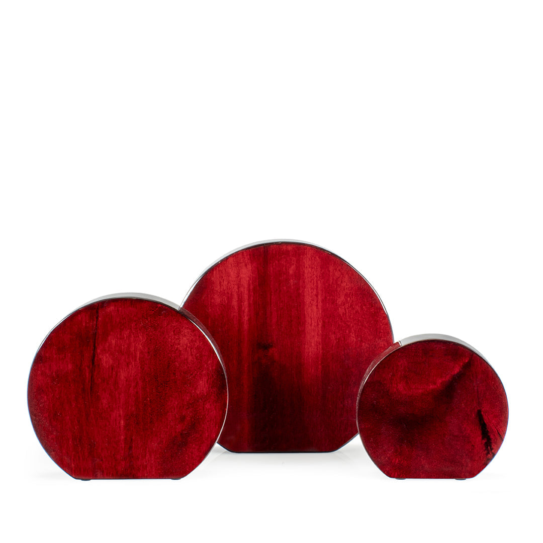 Three Prize Possessions Round Rosewood Awards of varying sizes, featuring polished deep red wood with dark grain patterns, are arranged side by side on a white background—perfect plaques for employee recognition.