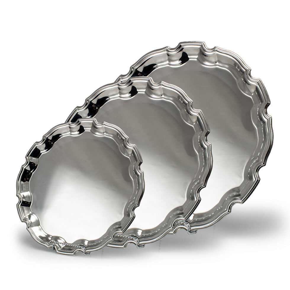 Three Prize Possessions Silverplate Scalloped Trays, arranged by size from front to back against a white background, create an elegant centerpiece display—perfect for serving or decor.