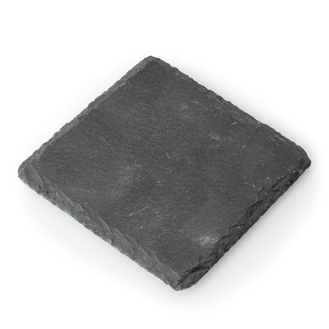 The Prize Possessions Square Slate Coaster (Set of 4) features flat, dark gray coasters with rough edges—an elegant addition to any slate coaster collection. Photographed on a white background.