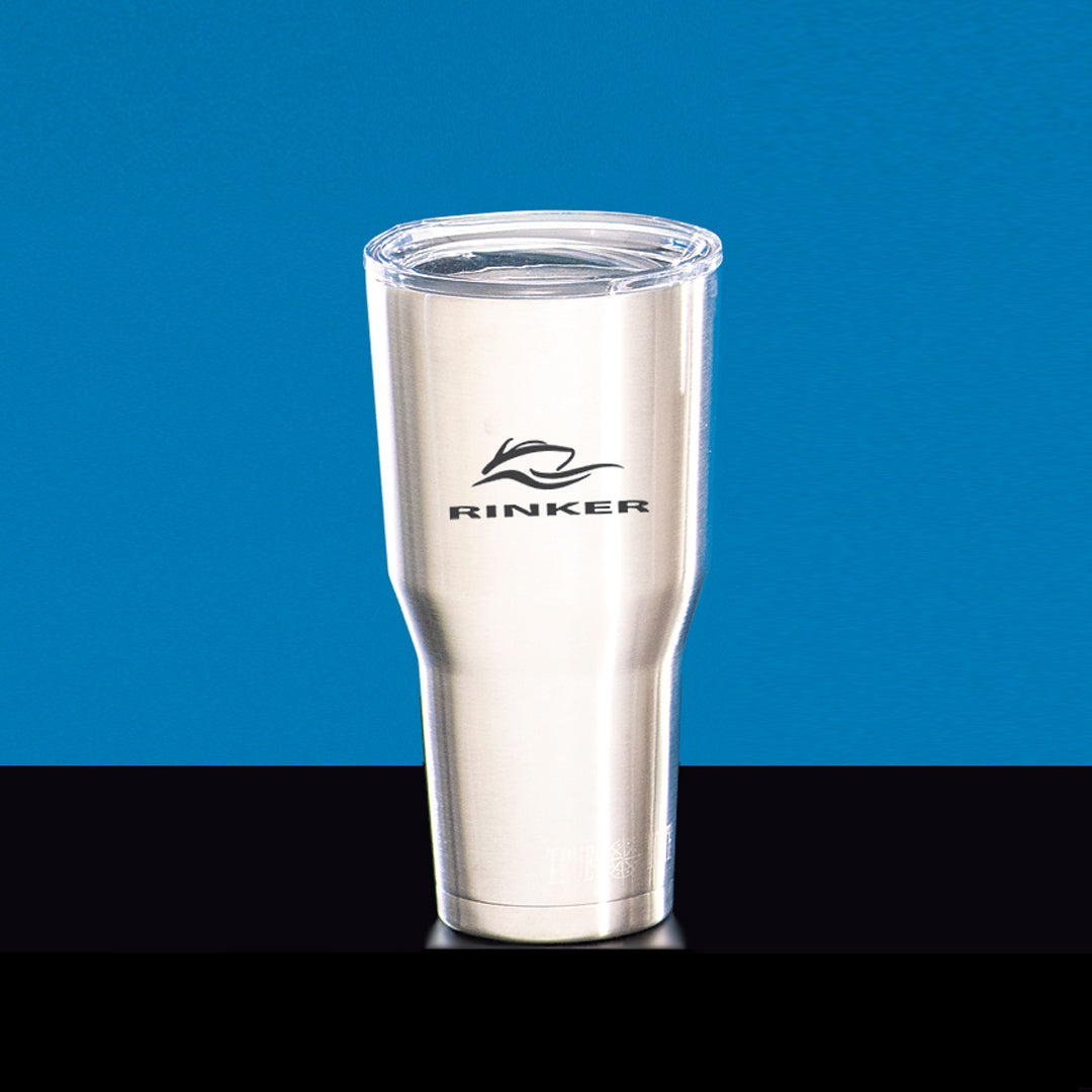 A Prize Possessions Stainless Steel Tumbler with double walls and a clear plastic lid is shown against a blue background on a black surface.