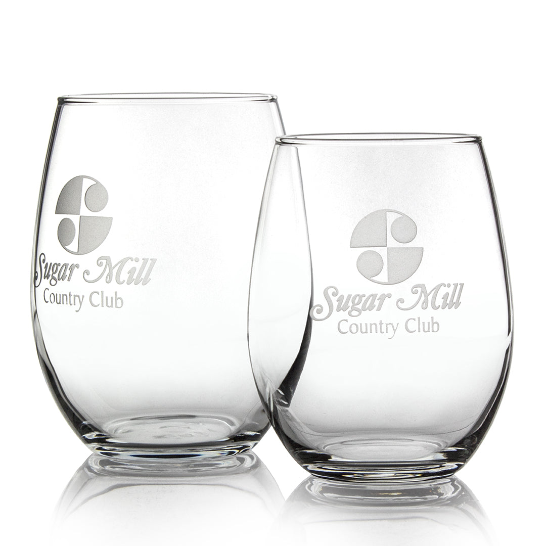 Two Prize Possessions Stemless Wine Glasses are shown side by side, each featuring an etched logo and Sugar Mill Country Club text. The clear glass stands out against a plain white background, ideal for casual dinners.
