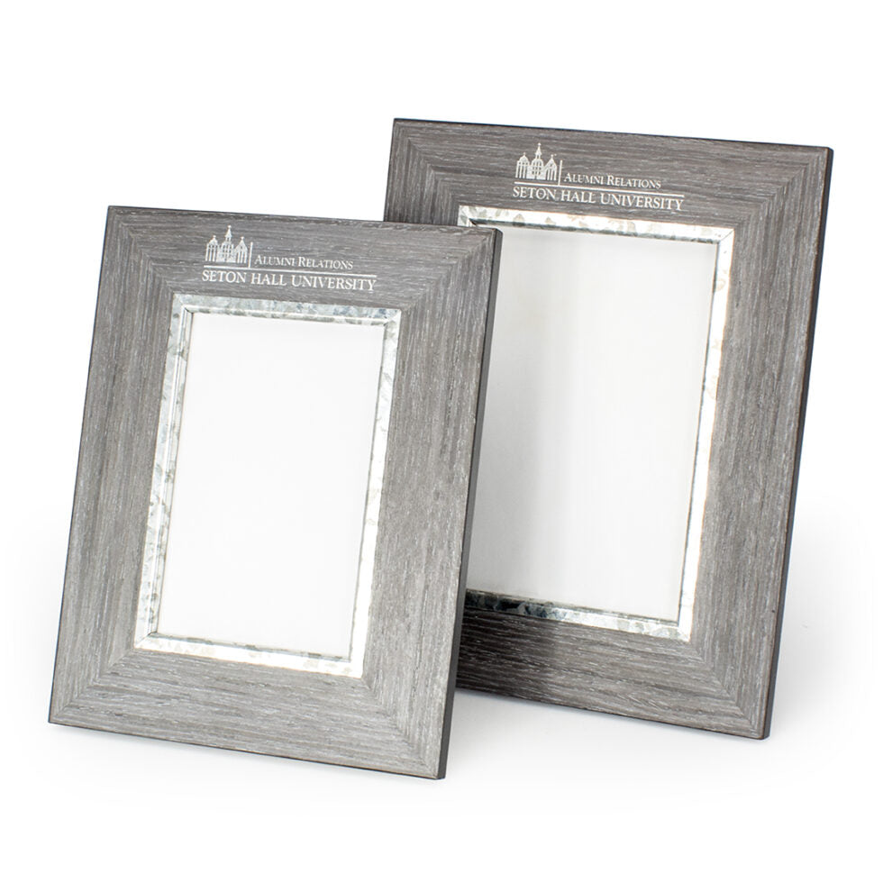 Two empty Prize Possessions Weathered Grey Frames, featuring the Seton Hall University Alumni Relations logo and text at the top, stand side by side on a white background—ideal for farmhouse decor.