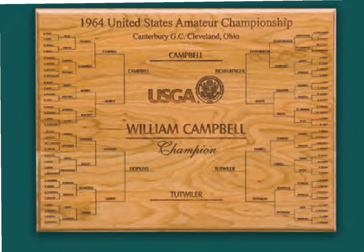 The Prize Possessions Wood Championship Plaque (Holds 64 Names) features the 1964 United States Amateur Championship bracket and "WILLIAM CAMPBELL Champion" engraved at the center, from Canterbury G.C., Cleveland, Ohio.